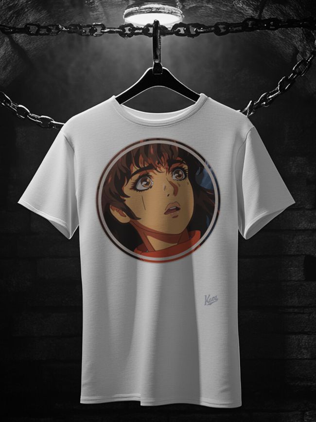 A white t-shirt hanging on a chain rack, featuring a surprised cartoon girl from the 90s with brown hair and large expressive eyes, illuminated dramatically against a subtle dark background.