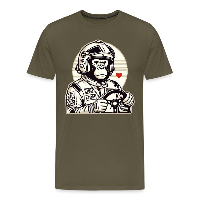 Graphic t-shirt in olive green featuring a cartoon monkey in a racing helmet holding a steering wheel, with a retro-style background and a heart graphic.
