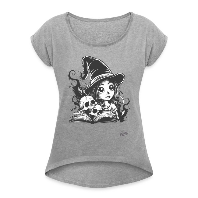 A grey T-shirt featuring a black-and-white gothic-style illustration of a young witch with a pointed hat, a spellbook, and skulls, surrounded by mystical dark energy.