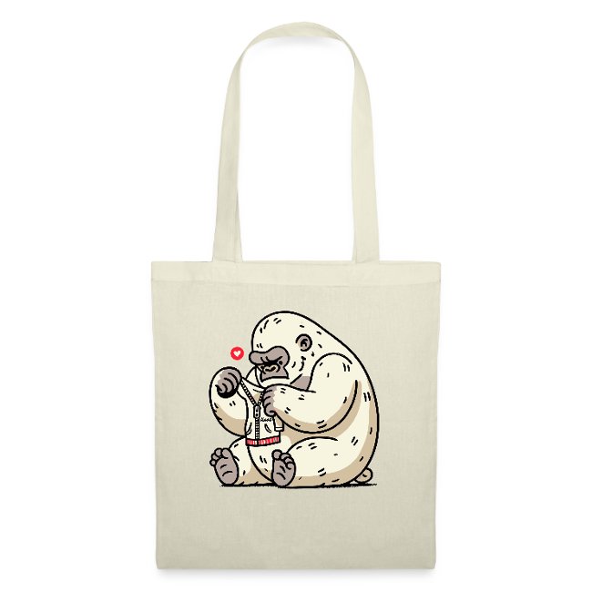 Illustration of a cute cartoon gorilla interacting with a small red drink container, surrounded by hearts, printed on a light beige tote bag.